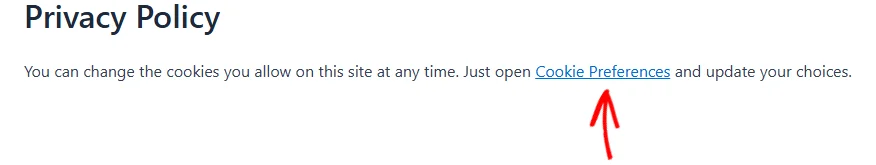Una frase en una página de WordPress con un enlace de texto de Preferencias de cookies, con una flecha apuntando al enlace