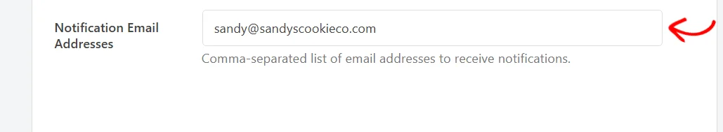 An arrow pointing at the Notification Email Addresses field, filled in with one address, above a note that the list is comma separated
