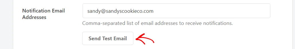 An arrow pointing at the Send Test Email button below the Notification Email Addresses field
